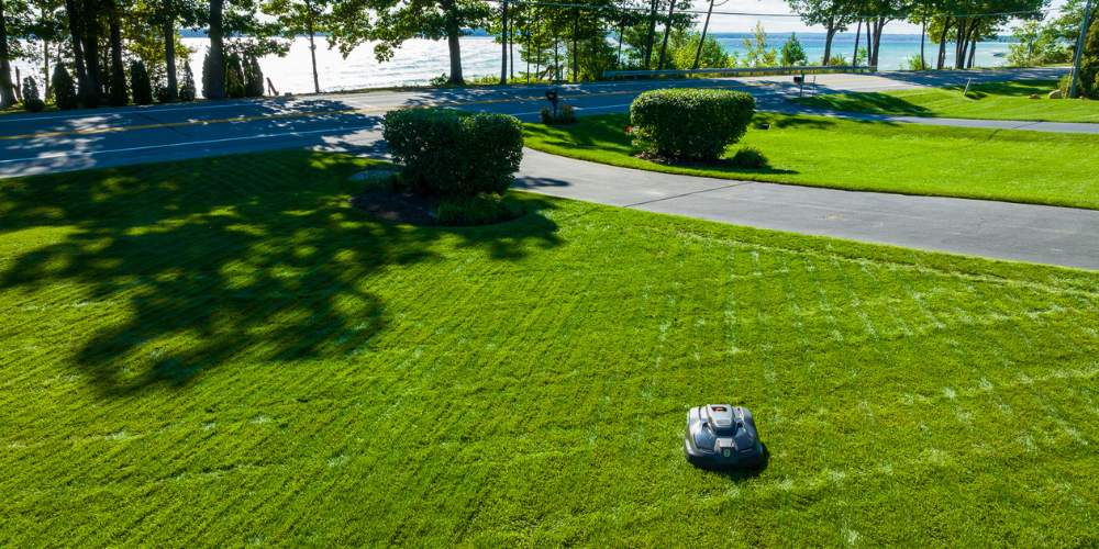 aerial photo of automower cutting grass