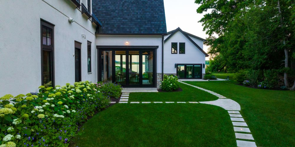 healthy lawn and stone steppers around home